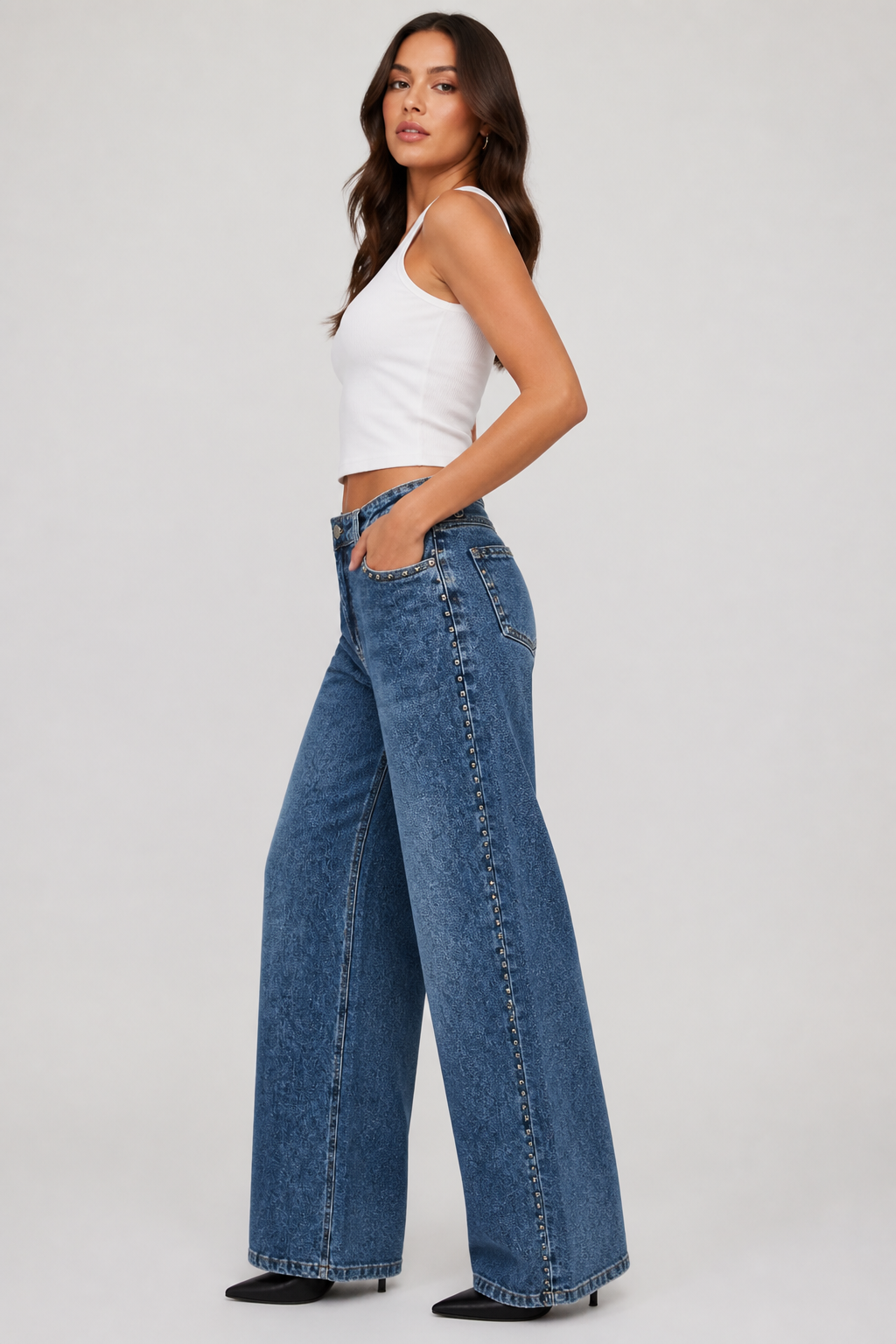 Jeans tachas cruzado