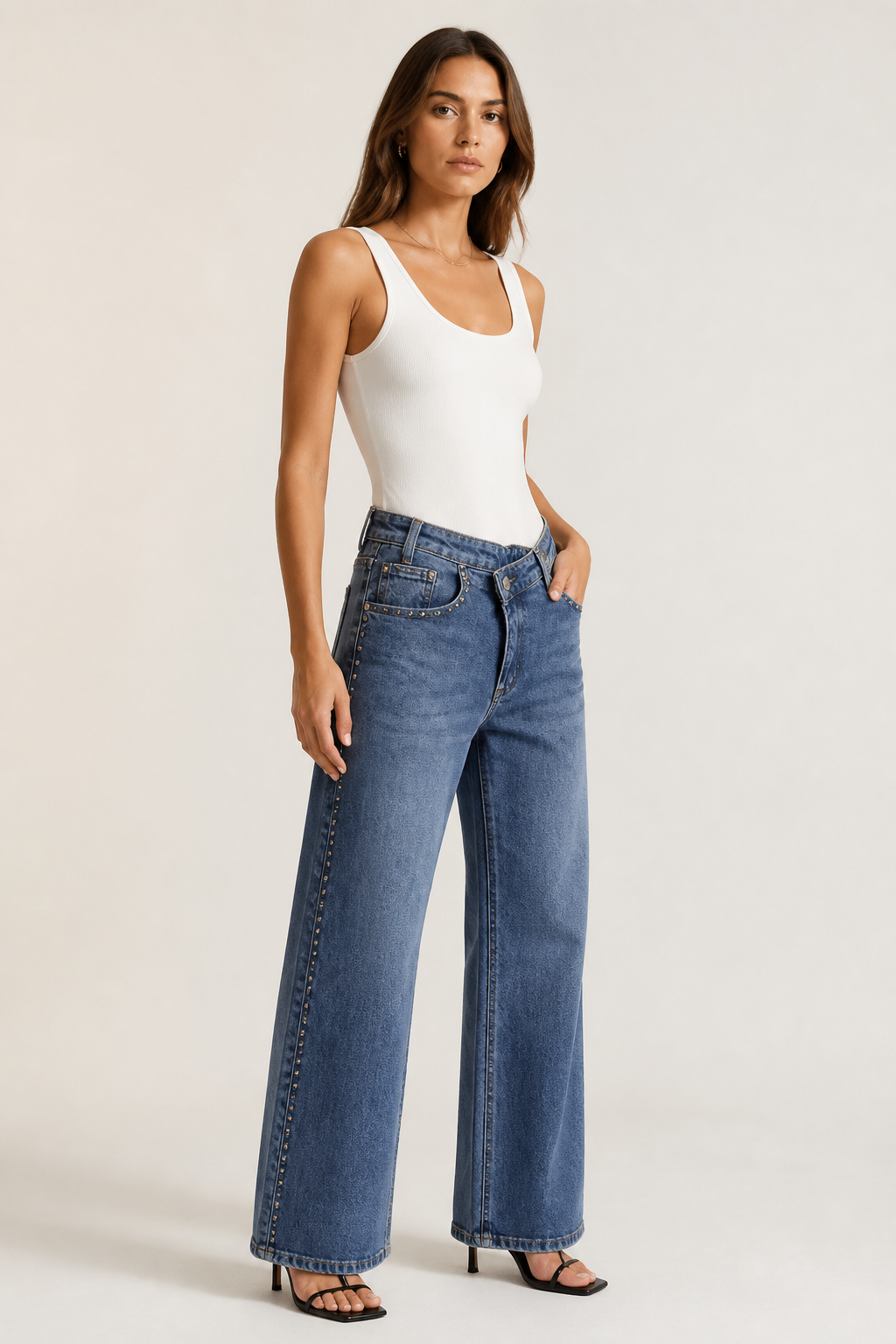 Jeans tachas cruzado